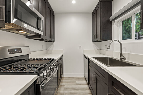 1BR rental in Los Angeles — All New One Bedroom w/ New Appliances | Koreatown, Echo Park, Silver Lake & DTLA | Stone quartz countertops with brand new self-closing cabinetry and high-end stainless-steel refrigerators